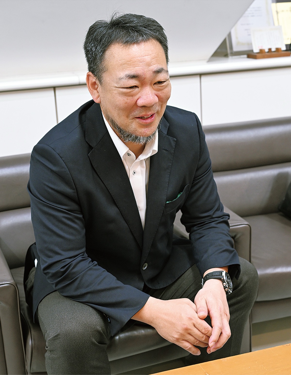 インタビューに答える三井組合長