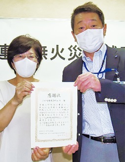 小石川会長（左）と出口区長