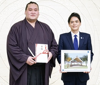 目録と土俵イメージ図を手にする照ノ富士関（左）と山中市長