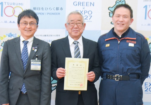 市場地区の内山副会長＝中央