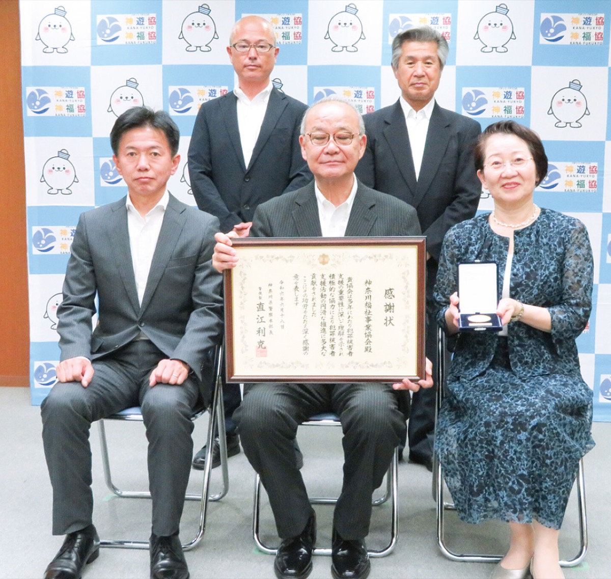 関係者による集合写真（同協会提供）