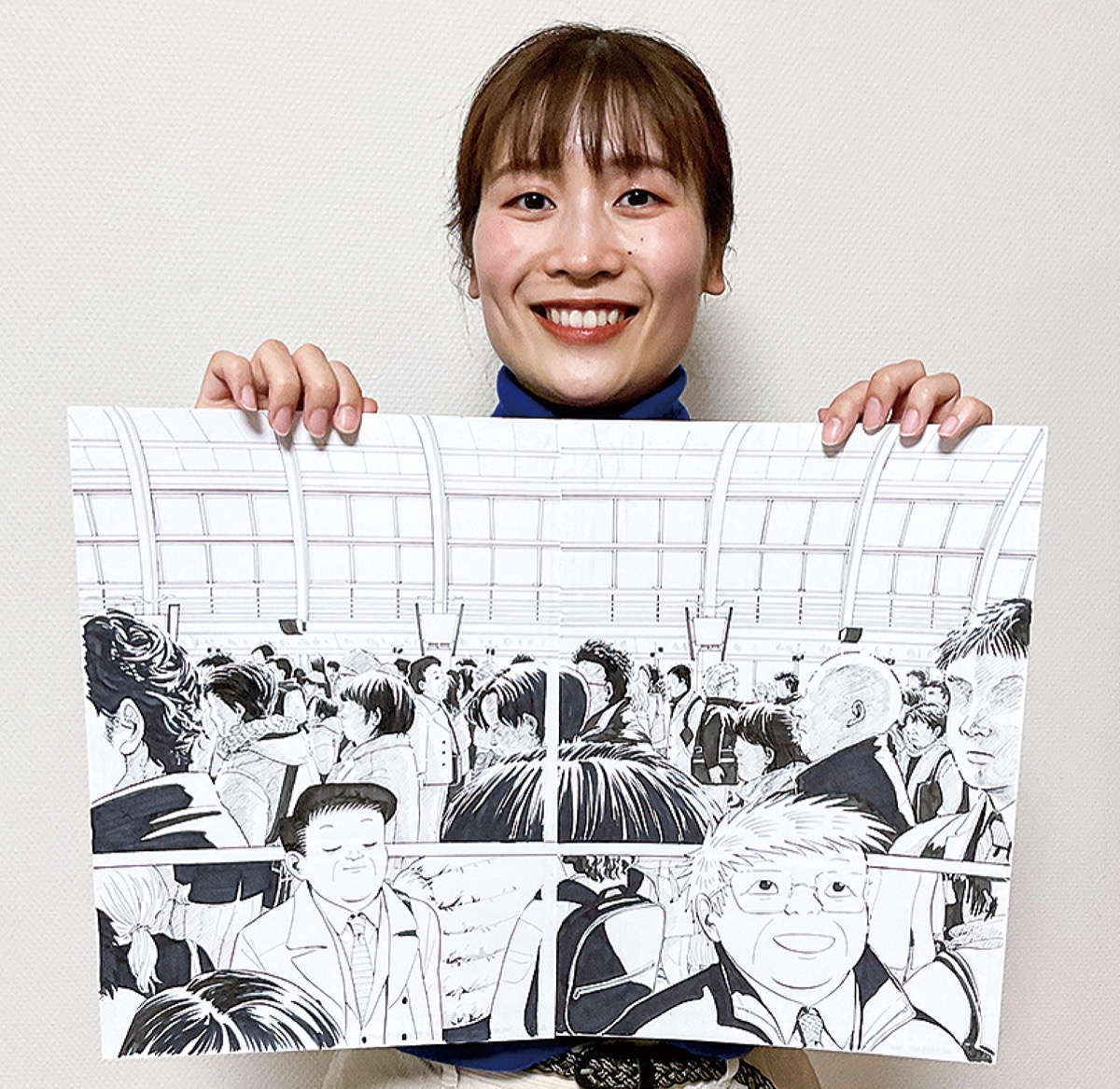 原画を手にする西村さん