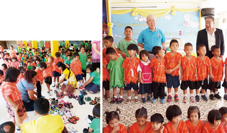 タイ・バンコクのバーンターナカムスクールの子どもたちへリユースシューズを寄贈。貧困地域であることから山道を素足で歩く子も多いという＝写真は相模原中ロータリークラブ提供