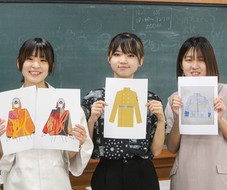 デザイン画を持つ（左から）鮫島さん、小松さん、小林さん