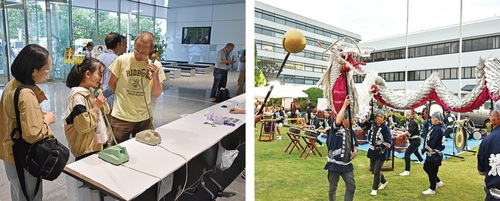 黒電話を体験する来場者と飯山白龍太鼓・舞の披露