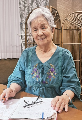 記憶を書き留めたノートと米山さん