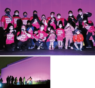 ピンクシャツを着て集まったメンバーと活動に賛同しライトアップされた新江ノ島水族館