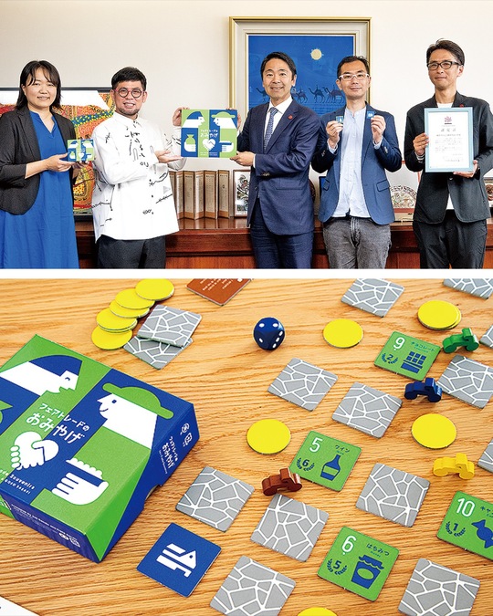 表敬訪問の様子（上）、開発されたボードゲーム