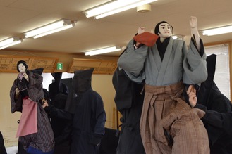 Shimonakaza performers holding puppets