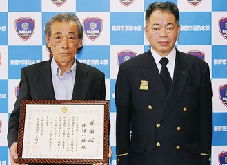 澤村さん（左）と三代消防長